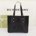 Burberry Embossed Crest Leather Tote In Black logo