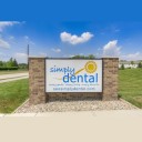 Simply Dental, Dr. John Clauss logo