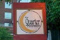 The Quarter Bar logo
