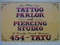 The Tattoo Parlor & Piercing Studio" logo