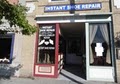 Instant Shoe Repair logo