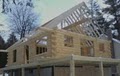 New England Log Home Builders logo