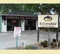 Schakolad Chocolate Factory logo