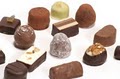 Teuscher Chocolates of Switzerland logo