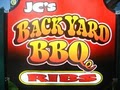 JC's Backyard BBQ logo