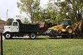 Top Grade Construction/ Dump Truck & Backhoe Service logo