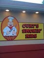 Curt's Smokin' Ribs logo
