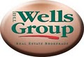 The Wells Group Real Estate Brokerage logo