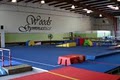 Woods Gymnastics logo