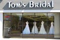 Tom's Bridal Warehouse logo